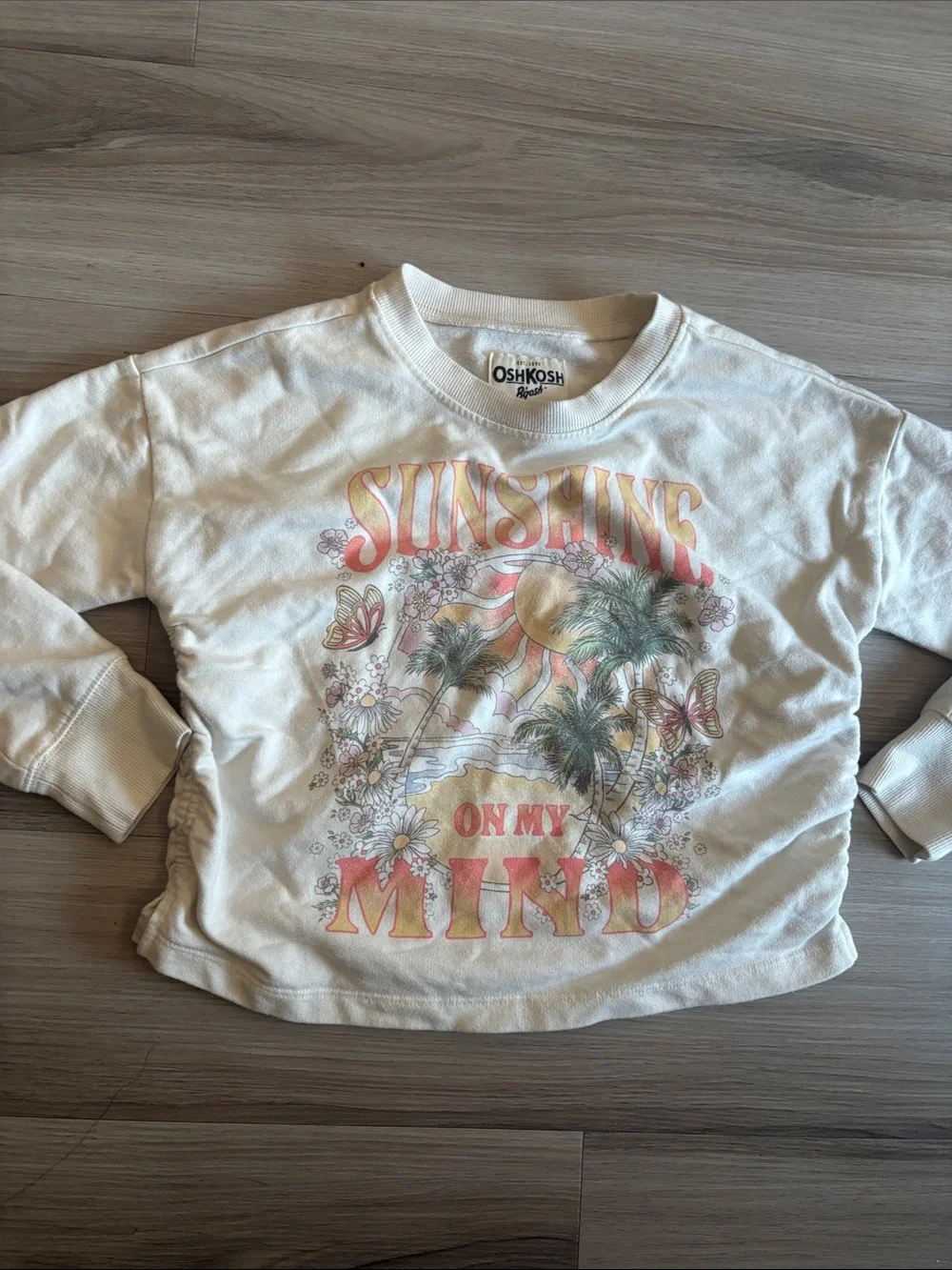 OshKosh B'gosh Cream long sleeve with Pastel Sunshine Graphic